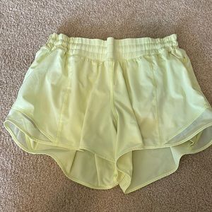 Bright yellow lined Lululemon shorts